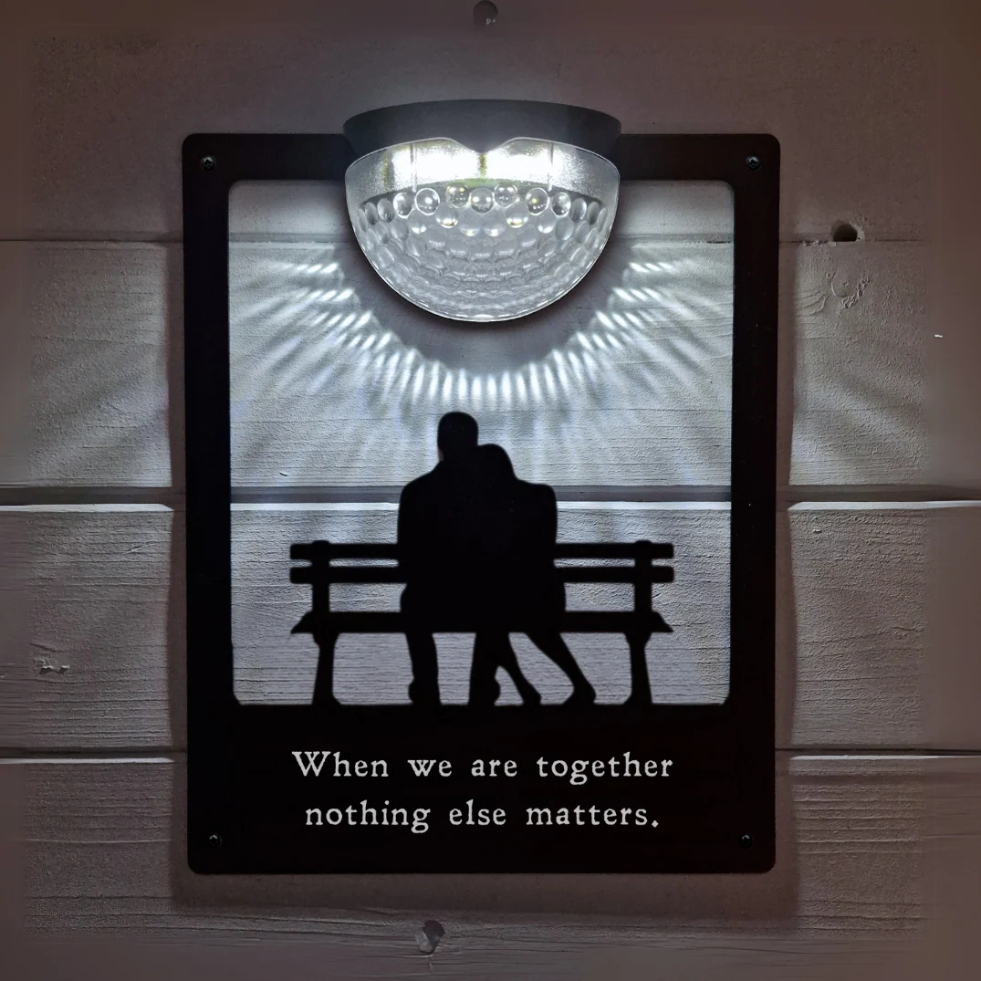 'When we are together nothing else matters' Couple on Bench Solar Light Wall Plaque